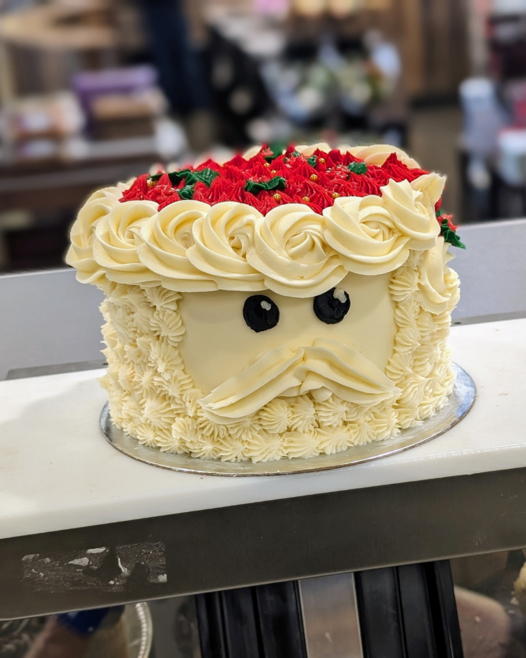 a cake with a santa face on it